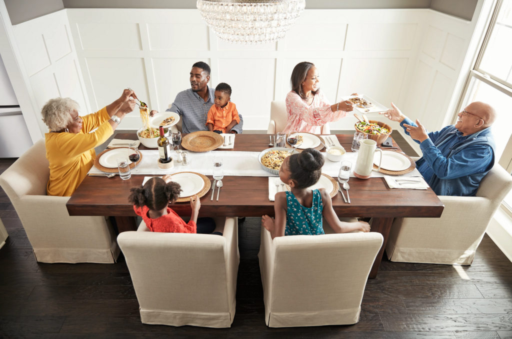 Family having breakfast at the dining table | Bow Family Furniture & Flooring