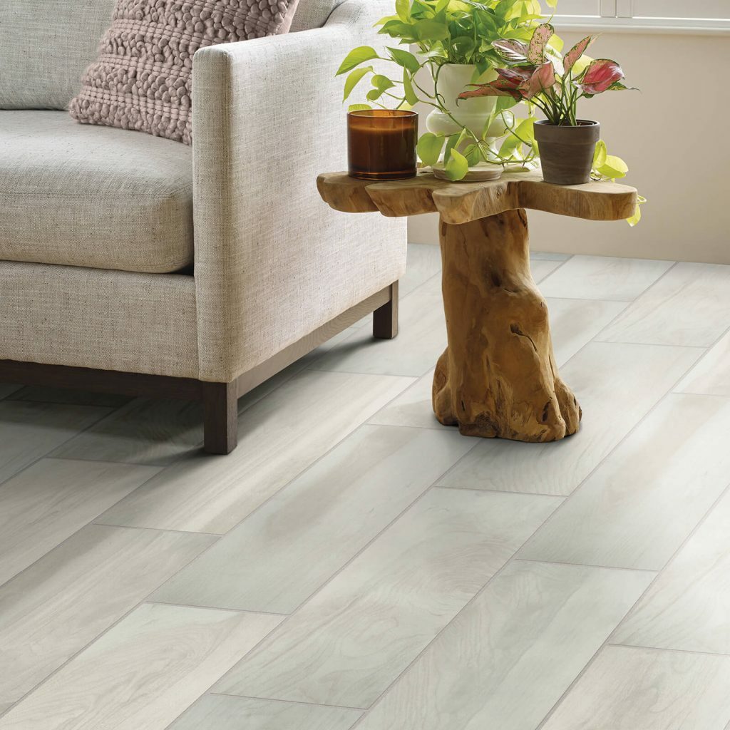 ceramic tile in living room with armchair | Bow Family Furniture & Flooring